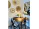 Charming dining area featuring a table set for four, decorative wall accents, and warm lighting at 309 Meeting St # 19, Charleston, SC 29401