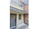 Charming front entrance with a wreath on the gray door and a flower box below the window at 309 Meeting St # 19, Charleston, SC 29401