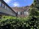 Exterior shot featuring the brick exterior of the building behind a hedge at 309 Meeting St # 19, Charleston, SC 29401