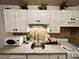 Well-lit kitchen featuring white cabinetry, modern appliances, and a functional layout at 309 Meeting St # 19, Charleston, SC 29401