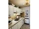 Efficient kitchen with white cabinets, concrete countertops, and modern appliances at 309 Meeting St # 19, Charleston, SC 29401