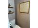 Stylish powder room showcasing decorative wallpaper, a modern toilet, and tasteful decor at 309 Meeting St # 19, Charleston, SC 29401