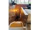 Stairway featuring an exposed brick wall and views into a bedroom, blending rustic charm at 309 Meeting St # 19, Charleston, SC 29401