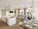 Inviting open-concept living area with abundant natural light, stylish decor, and kitchen views at 325 Longshore St # 1143, Daniel Island, SC 29492
