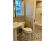 Updated bathroom with stylish patterned tile, pedestal sink and shower-tub combination at 377 Furman Ln, Ladson, SC 29456