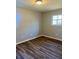 Neutral bedroom with updated wood look flooring and a window at 377 Furman Ln, Ladson, SC 29456