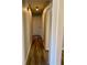 Hallway with luxury vinyl plank flooring and neutral paint, leading to bedrooms at 377 Furman Ln, Ladson, SC 29456