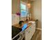 Bright kitchen featuring butcher block countertops, a farmhouse sink, and modern fixtures at 377 Furman Ln, Ladson, SC 29456