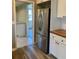 Modern kitchen with stainless steel refrigerator and views to additional room at 377 Furman Ln, Ladson, SC 29456