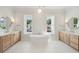 Luxurious bathroom with double vanities, a soaking tub, modern fixtures, and lots of natural light at 3846 Delinger Dr, Mount Pleasant, SC 29466