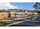Aerial view of a brick school building, parking lot and tree lined streets at 3846 Delinger Dr, Mount Pleasant, SC 29466