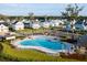 Aerial view of community pool with sun loungers, and manicured green space at 3846 Delinger Dr, Mount Pleasant, SC 29466