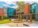 Attractive building with large windows and decorative landscaping and trees planted in a circular garden at 3846 Delinger Dr, Mount Pleasant, SC 29466