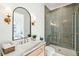 Contemporary bathroom with stylish vanity, framed mirror, and green tiled walk-in shower at 3866 Delinger Dr, Mount Pleasant, SC 29466
