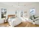 Sun-filled bedroom featuring neutral decor, multiple windows, and hardwood floors at 3866 Delinger Dr, Mount Pleasant, SC 29466