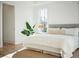 Sunlit bedroom features a plush bed, neutral tones, and a serene atmosphere at 3866 Delinger Dr, Mount Pleasant, SC 29466