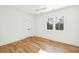 Bright bedroom features hardwood floors, white walls, and a double-door closet at 3866 Delinger Dr, Mount Pleasant, SC 29466