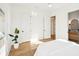 Bright bedroom offers a neutral color palette, with hardwood flooring, and entry to bathroom at 3866 Delinger Dr, Mount Pleasant, SC 29466