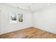 Bright bedroom features hardwood floors, white walls, and natural light at 3866 Delinger Dr, Mount Pleasant, SC 29466