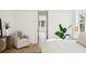 Cozy, light-filled bedroom with neutral decor and an inviting armchair at 3866 Delinger Dr, Mount Pleasant, SC 29466