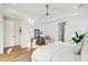 Bright bedroom with modern ceiling fan, inviting chair, and light-colored walls at 3866 Delinger Dr, Mount Pleasant, SC 29466