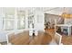 Open dining area with round table, wicker chairs, and view into the living room and kitchen at 3866 Delinger Dr, Mount Pleasant, SC 29466