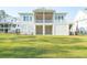 Beautiful two-story home with a screened-in porch, white siding, and a well-manicured lawn at 3866 Delinger Dr, Mount Pleasant, SC 29466