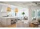 Open-concept kitchen with a large island, bar stool seating, and access to the dining and living rooms at 3866 Delinger Dr, Mount Pleasant, SC 29466