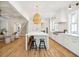 Open kitchen layout with island seating, white cabinets, and stainless steel appliances at 3866 Delinger Dr, Mount Pleasant, SC 29466