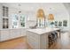 Open kitchen with center island, modern lighting, and stainless appliances for a gourmet cooking experience at 3866 Delinger Dr, Mount Pleasant, SC 29466