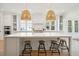 Gourmet kitchen boasts a large island with bar stool seating and modern pendant lighting for cozy entertaining at 3866 Delinger Dr, Mount Pleasant, SC 29466