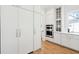 Kitchen area features white cabinets, stainless steel appliances, and a view of the pantry at 3866 Delinger Dr, Mount Pleasant, SC 29466