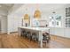 Spacious kitchen featuring a large island, hardwood floors, and wicker pendant lights at 3866 Delinger Dr, Mount Pleasant, SC 29466