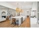 Bright, open kitchen with island seating and stainless appliances, flowing into the living area at 3866 Delinger Dr, Mount Pleasant, SC 29466
