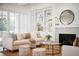 Well-lit living room featuring built-in shelving, fireplace, modern furniture, and a sliding glass door at 3866 Delinger Dr, Mount Pleasant, SC 29466