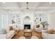 Comfortable living room with a fireplace, built-in shelves, ceiling fan, and a cozy seating arrangement at 3866 Delinger Dr, Mount Pleasant, SC 29466
