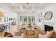 Open living room flows to dining area, showcasing a fireplace, built-ins, and expansive sliding doors at 3866 Delinger Dr, Mount Pleasant, SC 29466