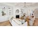 Bright living room with custom built-ins, fireplace, and coffered ceilings for elegant entertaining at 3866 Delinger Dr, Mount Pleasant, SC 29466