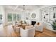 Elegant living room with coffered ceilings, built-in shelving, fireplace and sliding doors for natural light at 3866 Delinger Dr, Mount Pleasant, SC 29466