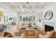 Bright, spacious living room with a fireplace, stylish built-ins, and large sliding glass doors to outdoors at 3866 Delinger Dr, Mount Pleasant, SC 29466