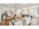 Open-concept living area flows into the kitchen, boasting hardwood floors and stairs to the second level at 3866 Delinger Dr, Mount Pleasant, SC 29466