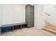 Well-organized mudroom with a built-in bench, storage cabinet, and stairs leading to the upper level at 3866 Delinger Dr, Mount Pleasant, SC 29466