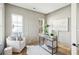 Bright office space features paneled walls, hardwood floors, natural light, and stylish decor at 3866 Delinger Dr, Mount Pleasant, SC 29466
