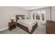 Cozy bedroom with a large window, a comfortable bed, and a nightstand and dresser, perfect for relaxation at 4 Falcon Point Rd, Kiawah Island, SC 29455