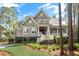 Charming two-story home with a covered porch and lush landscaping at 4 Falcon Point Rd, Kiawah Island, SC 29455