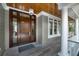 Elegant front door with sidelights and wood ceiling at 4 Falcon Point Rd, Kiawah Island, SC 29455