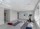 Bright home gym featuring large windows, a Peloton bike, and space for yoga, perfect for fitness enthusiasts at 4 Falcon Point Rd, Kiawah Island, SC 29455