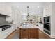 Well-equipped kitchen with granite countertops, stainless steel appliances, and ample cabinet space at 4 Falcon Point Rd, Kiawah Island, SC 29455