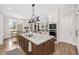 Bright and airy kitchen with a large island, modern appliances, and seamless flow to the living area at 4 Falcon Point Rd, Kiawah Island, SC 29455