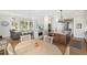 Open-concept kitchen with a large island, marble countertops, and views of the living area at 4 Falcon Point Rd, Kiawah Island, SC 29455